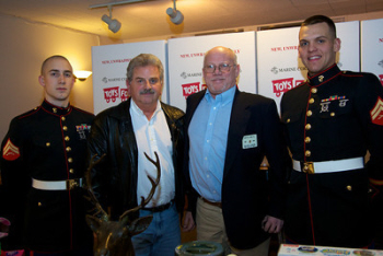 Seattle Elks Toys for Tots Co-Chairs Trustee Nick Santora (l) and PER Bill McCabe (r) with Cpls Van Cleave & Mahoney USMC. This year was the second visit to our Lodge for both Marines.