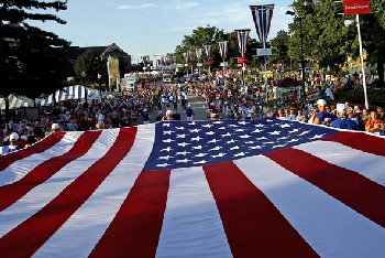 The members of Elks Lodge 158 proudly carry the garrison flag in the Twilight Parade to kick off the State Fair. (Photo courtesy of Jonathan Kirshner/The State Journal-Register)