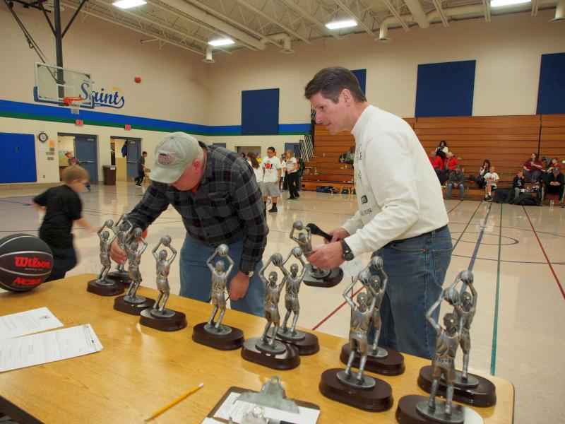 Preparing for boys and girls trophies and awards. All boys and girls received free T-Shirts, and all were served food and beverages following the competition. 