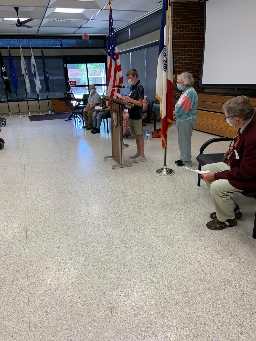 Student Reading Essay "What a Flag Means to Me"