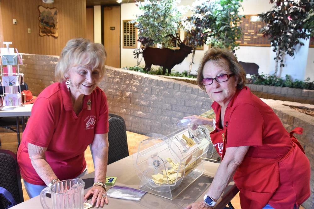 Ann and Karen working on the raffle.