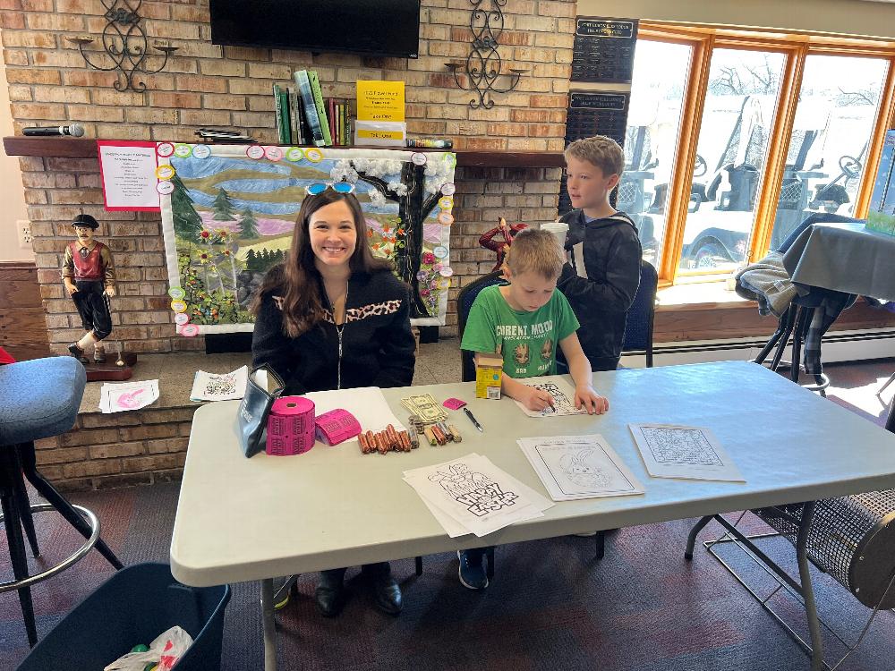 Tristin Balinski, Children's Programs Committee Chairperson waits for the Easter Egg Hunt to begin