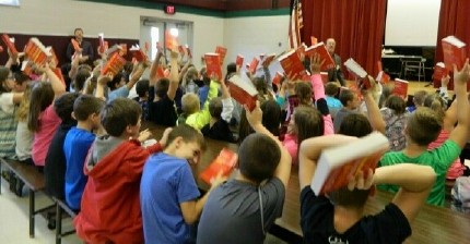 Recently the Uniontown Elks #370 presented dictionaries to 3rd and 4th grade students of A.L. Wilson, Smithfield and Masontown Elementary schools.  Three hundred books were distributed to the excited students after a short presentation.    The goal of this program is to assist all students in becoming good writers, active readers, creative thinkers, and resourceful learners by providing them with their own personal dictionary.  The dictionaries are a gift to each student to use at school and at home for years to come.  Uniontown Elks have been sponsors of this program for several years.  All faculty and students are very grateful.

PICTURE:  Students of Masontown Elementary grin from ear to ear after receiving their dictionaries. Pictured from left to right:  Jacob Riggle, Maeghan Chance, Riley Rhodes, Darrius Darnell, Dane Cumer, Tatum Hettenschuller, Jason Jackson, Alana Hetterschuller, and Keith Hilling, Elks representative.

 PICTURE:  3rd and 4th grade student at A.L. Wilson raise their new dictionaries and say “Thank You”.
