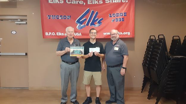 With the Tucson Elks Lodge #385 meeting and exceeding the Arizona Elks Major Projects per capita, the funds received ($1,000.00) for this achievement were donation on June 11, 2024 to the Tucson AZ Amphitheatre High School Summer league to help with uniforms, equipment, basketballs for the summer program. 