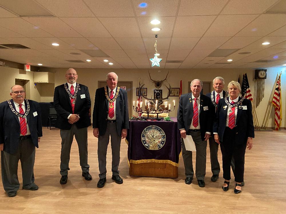 Tucson Elks Lodge #385 December 5, 2021 Memorial Service: L-R: Chaplain, J. Riley, Lecturing Knight M. Lessley, ER W. Burns, Trustee J. Sanford, Loyal Knight C. Winters and Leading Knight S. Trecartin.  To Our Absent Members. 