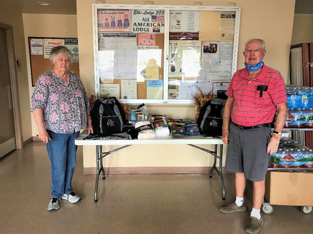 June 26th 2020, Tucson Elks Lodge #385 donated to the Veterans Homeless Program 25 backpacks, bottled water, socks and underwear, using Elks National Veterans Service Commission Freedom grant money and donations totaling $1083.00. Picture is Trustee/PER B. Holyoak and Lodge VA Co-Chair Teen Morgan.  
