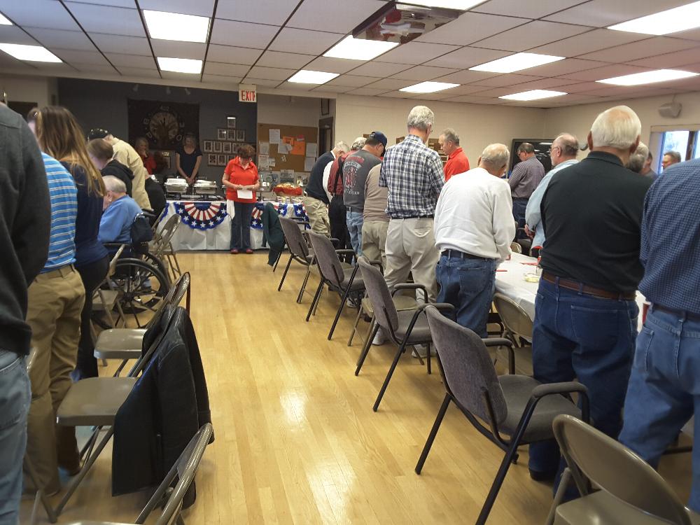 Table prayer prior to the luncheon.  Prayer was led by Jeff Stran.