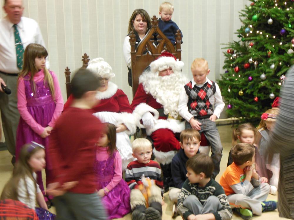 Santa and his helper visit the Bennington Lodge.