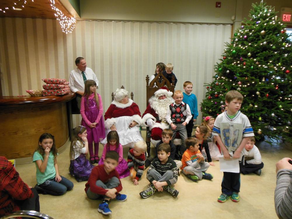 Santa and his helper visit the Bennington Lodge.