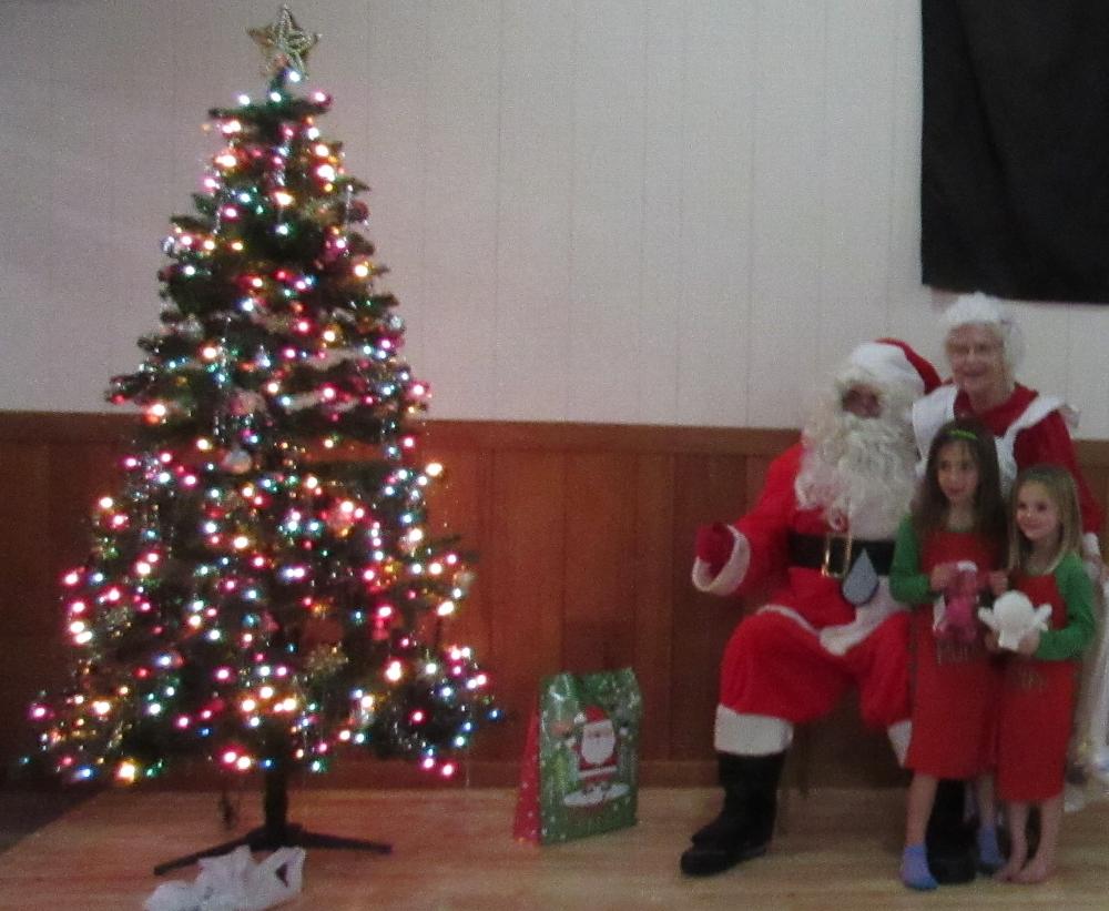 Santa Claus Paul Nelson and Mrs Claus JR Latimer at the annual Pajama Party