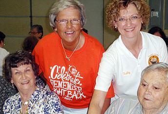 Exalted Ruler Kathy Robbins(standing right) of Paris Elks Lodge 816 assists Joyce Bass of the Relay for Life in serving meals to 196 cancer survivors. The Survivors Dinner is held 1 week before the Relay for Life event in Paris every year. The Paris Lodge has sponsored and prepared the meal for the last 10 years.