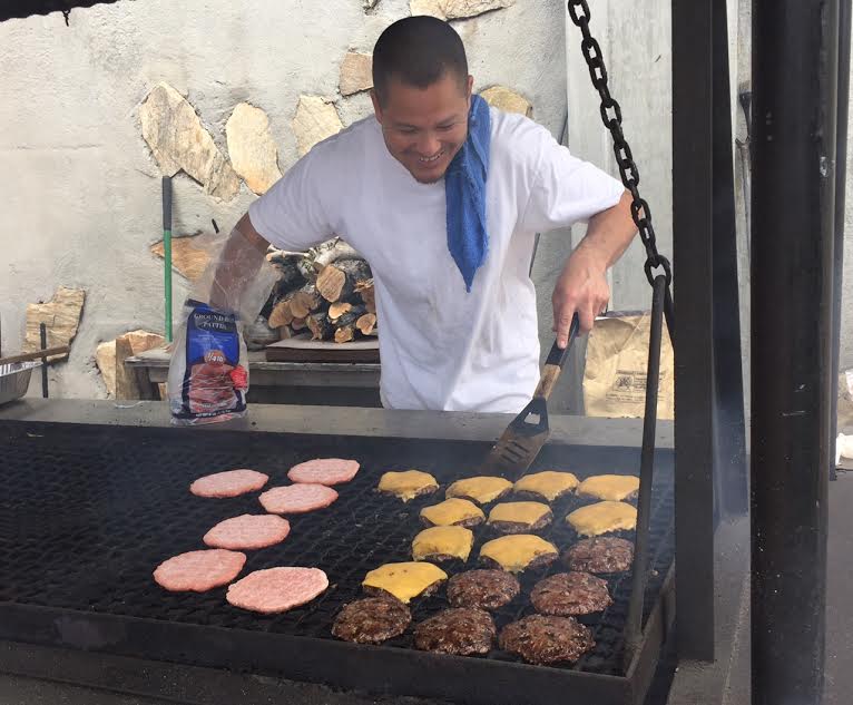 Evan Clark mastering the grill on Pool Prep Day 
- May 2016