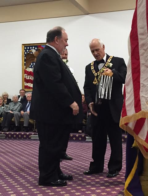 Incoming ER Mark Violante, presenting a gift to retiring ER Mark Swanson 
- April 2016 