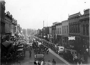 The 1927 parade in downtown Macon, part of thje celibration during the Missouri Elk's Convention. Vine street east from Rollins street