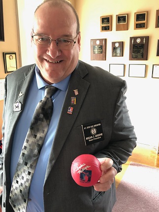 State President Brian Greene displays a memento autographed by Sophie Phillips, the 2017 Elks National Hoop Shoot Finalist from Greenwich, NY Elks Lodge #2223