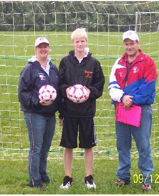 PER Terri Scott (left) and PDD Patrick Rooney (right) with Patrick's son at 2009 Soccer Shoot.