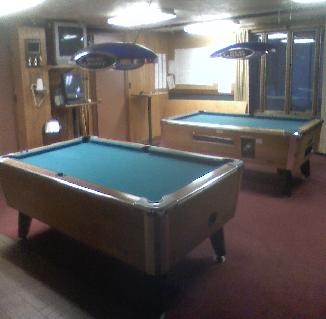 Two pool tables waiting for someone who's got game!