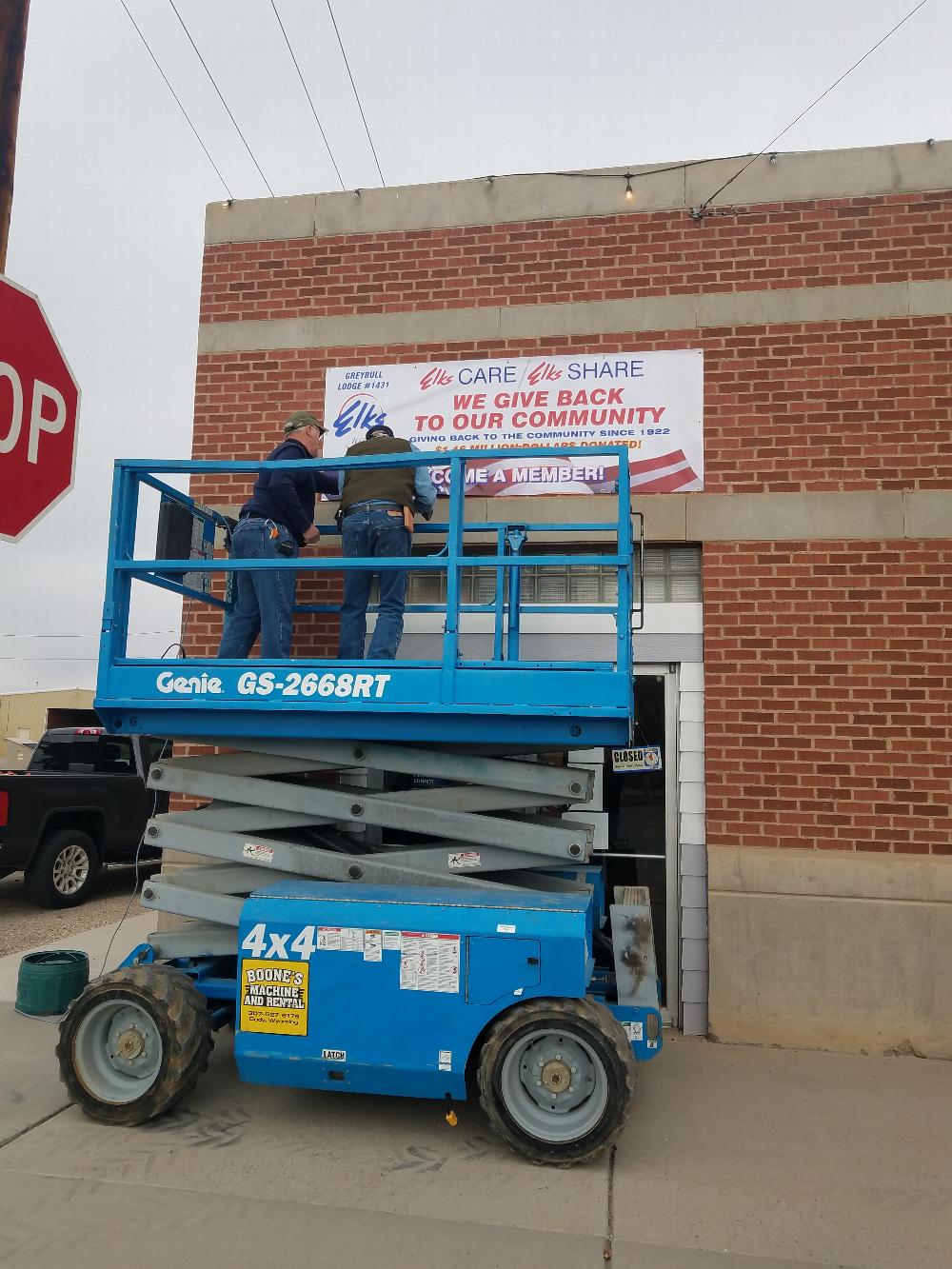 Bobby Werner and Jake Holthues putting up the Greybull Elks Lodge Donation Banner. Since 1922 to present the Greybull Elks Lodge has donated 1.16 million dollars back to the Greybull community. ELKS CARE, ELKS SHARE.