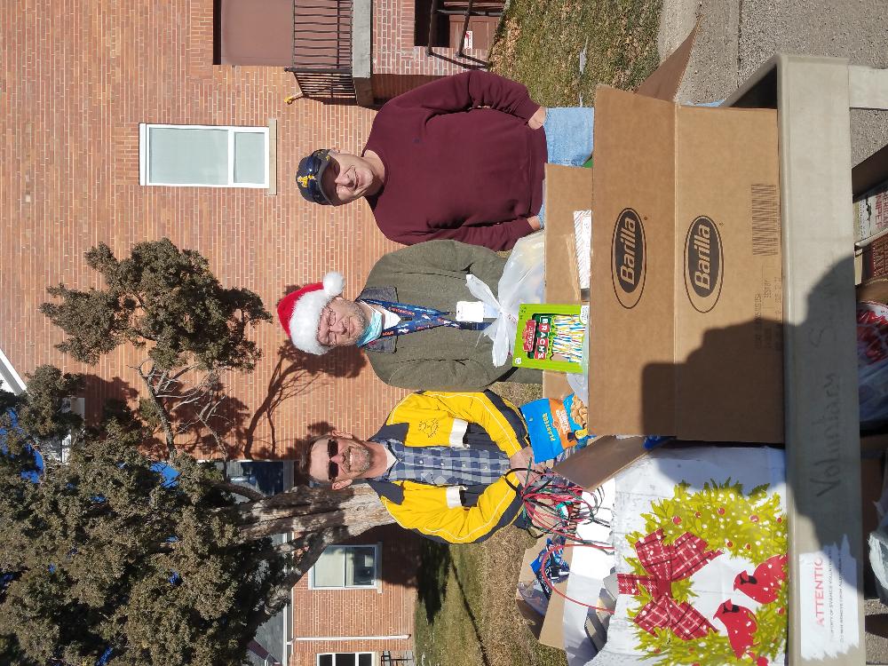 Ted Peterson, Elks #1431 Leading Knight; Eric Vielhauer, Sheridan VA Program Manager, and Jeff Sukut, Elks #1431 Exalted Ruler with donated Christmas gifts given by the Greybull Community to the Sherian VA Hospital in Sheridan, WY.