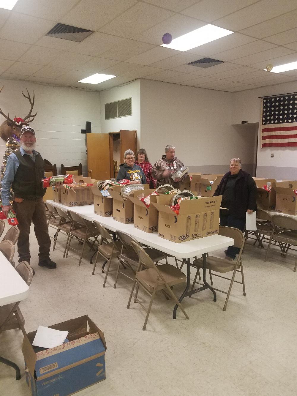 Jake and Buff Holthues, Brenda Miller, Mike Laird and Sherri Wilkinson putting the 2021 Elks Community Christmas Baskets together. The Greybull Elks had a total of 15 baskets for families in need. This was down from year 2020 as 30 baskets were prepared.