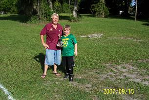 CHAIRMAN PER TOM HOPP PRESENTING THE TROPHY TO OUR SOCCER SHOOT WINNER ON 09/15/07.  THE SHOOT TOOK PLACE AT THE LODGE