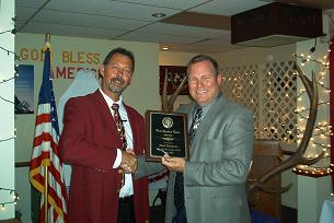 MATT PIEPER PRESENTING MARK THOMPSON WITH THE PER OF THE YEAR AWARD