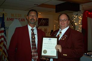 MATT PIEPER PRESENTING DEAN YEAGER WITH THE OFFICER OF THE YEAR AWARD