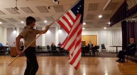 Scouts presented each flag as Secretary John Fowler spoke of their history