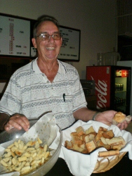 We have a new Bread Baker in Elk Town and his name is Karl Reich.  Karl has joined our kitchen team and is always coming up with home made surprises for us to enjoy!  Pictured here are 3 goodies he gave us last Wacky Wed. Home made Italian bread to go with the spaghetti – which was a great meal, by the way.  Then he came around to the tables and had us sample his home made gnocci.  To make the evening a total hit, home made cream puffs!!!!!!!!!!
I love the man!
