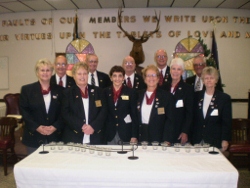 Friends & members of the Sebring Elks #1529 (along with all Lodges in the United States) gathered December 4th for a Memorial Service for all members who died this past year.  The Avon Park High School Show Choir, directed by Joy Loomis “shared their gift of music” and District VP Jim Mason spoke about the History of the Elks 11 O’Clock Toast which honors our deceased members.  Pictured here are the Officers of Lodge #1529 and members of the Avon Park Choir.