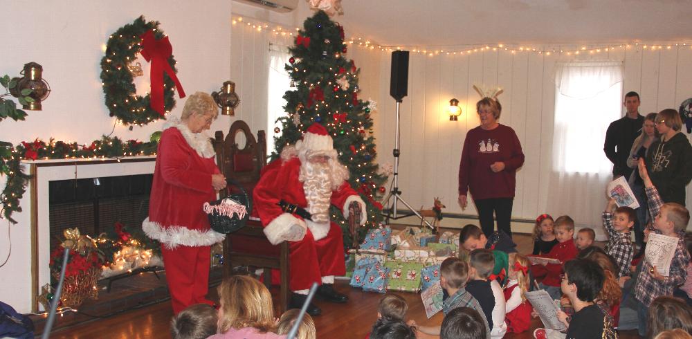 Santa prepares to give out gifts to the children!