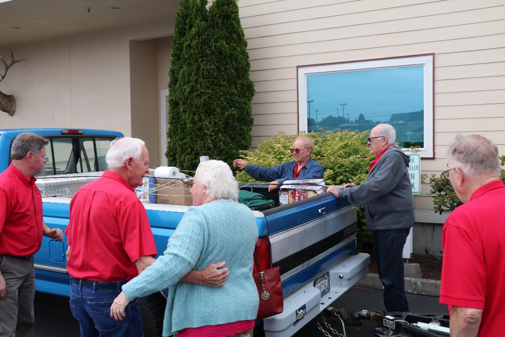 Loading up the equipment and food needed for the BBQ Hamburger meal offered after the Read a Book, Watch the Movie Event in Mount Vernon, Washington