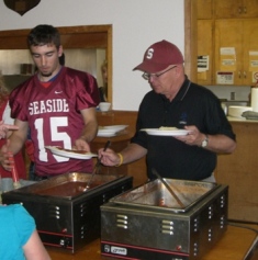 Coach Dean and student serving up the spaghetti  Oct. 11, 2009