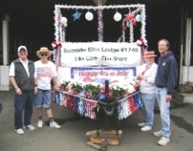 Trustee John, Inner Guard Joan, Citizen of the Year Judy and Member Dave 
putting the finishing touches on the 4th of July Float