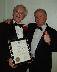 Jan Jackson with ER John Morris
She looks pleased to be Officer of the Year!  
