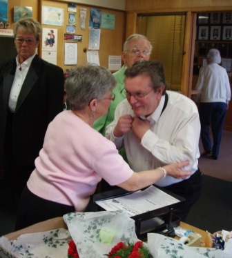 Joan Beneke and Hugh Kerwin watch as Patsy Kerwin ATTEMPTS to help our new Esquire Dennis Brodigan tie his tie