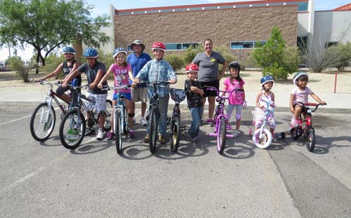 The eight winners of the bicycles given away at the event. 