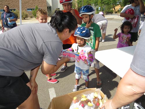 Youth Activities Chairman Maria Sanchez hands out prizes.