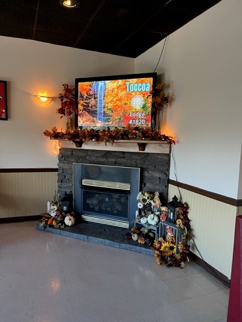 Warm up by the fireplace in the winter just inside our lounge. 