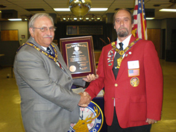 Presenting the plaque to the Exalted Ruler.