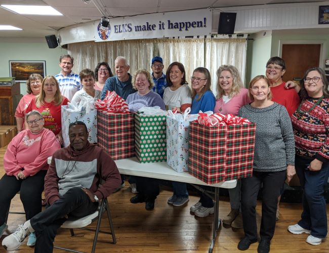 Volunteers packing gift bags at the lodge.