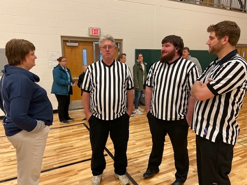 Hoop Shoot Coordinator Heather Perry speaking before the 2019 event with Rick Woolridge, ER Jonathon Ward and Nathan Walz. 