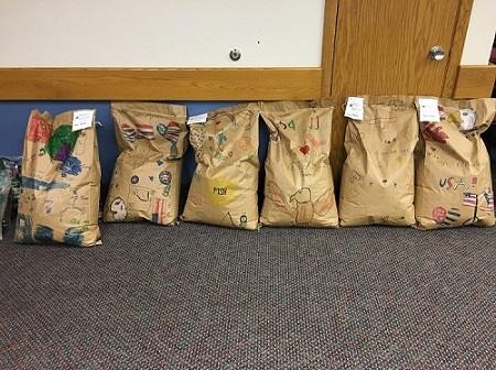 These bags of donated birdseed were decorated by local students and were destined for use at the Michael J Fitzmaurice State Veterans Home.