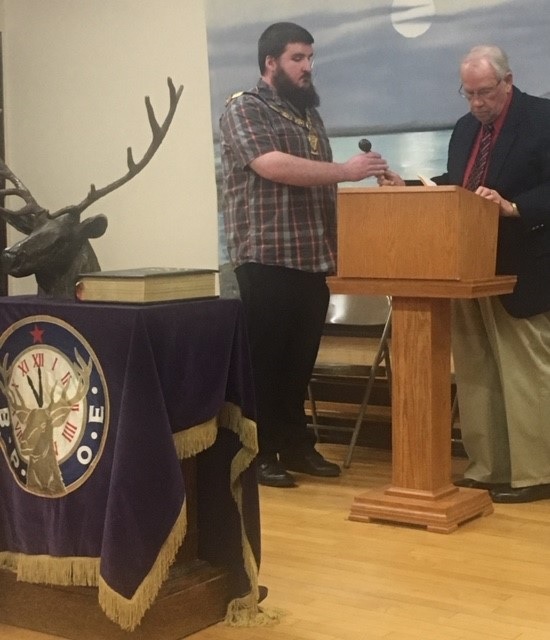 PER Dwight Pogany passing the gavel to new Exalted Ruler Jonathon Ward at the completion of the 2019 installation ceremony.