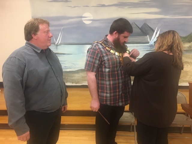 New Pierre Elks Lodge ER Jonathon Ward receives a boutonniere following the 2019 installation ceremony from his mother Karen Ward.