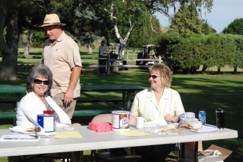 Co-chair Frank Millar is checking on the backbone of the golf tournament signup volunteers.