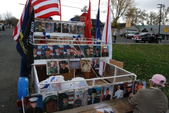 Pictures of local persons deployed in the Armed Services makes this Veteran's Day parade entry a personal interest for Veteran Rolene Elliot.