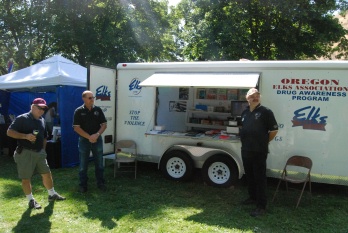 r-l PER Jeff Shorey and PER Mike Brown man the OSEA Drug Awareness trailer at the Muddy Frogwater weekend. Trustee Rick Kain is getting some pointers before his shift. 