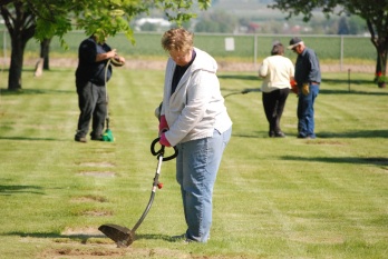 Diane Deseve with a dozen others ascended on the local cemetary to give the Veteran's headstones a facelift prior to Memorial Day.