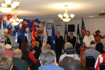 PER Larry Hetterley at podium with Officers at the Military Flags for the Veteran's Flag Service.